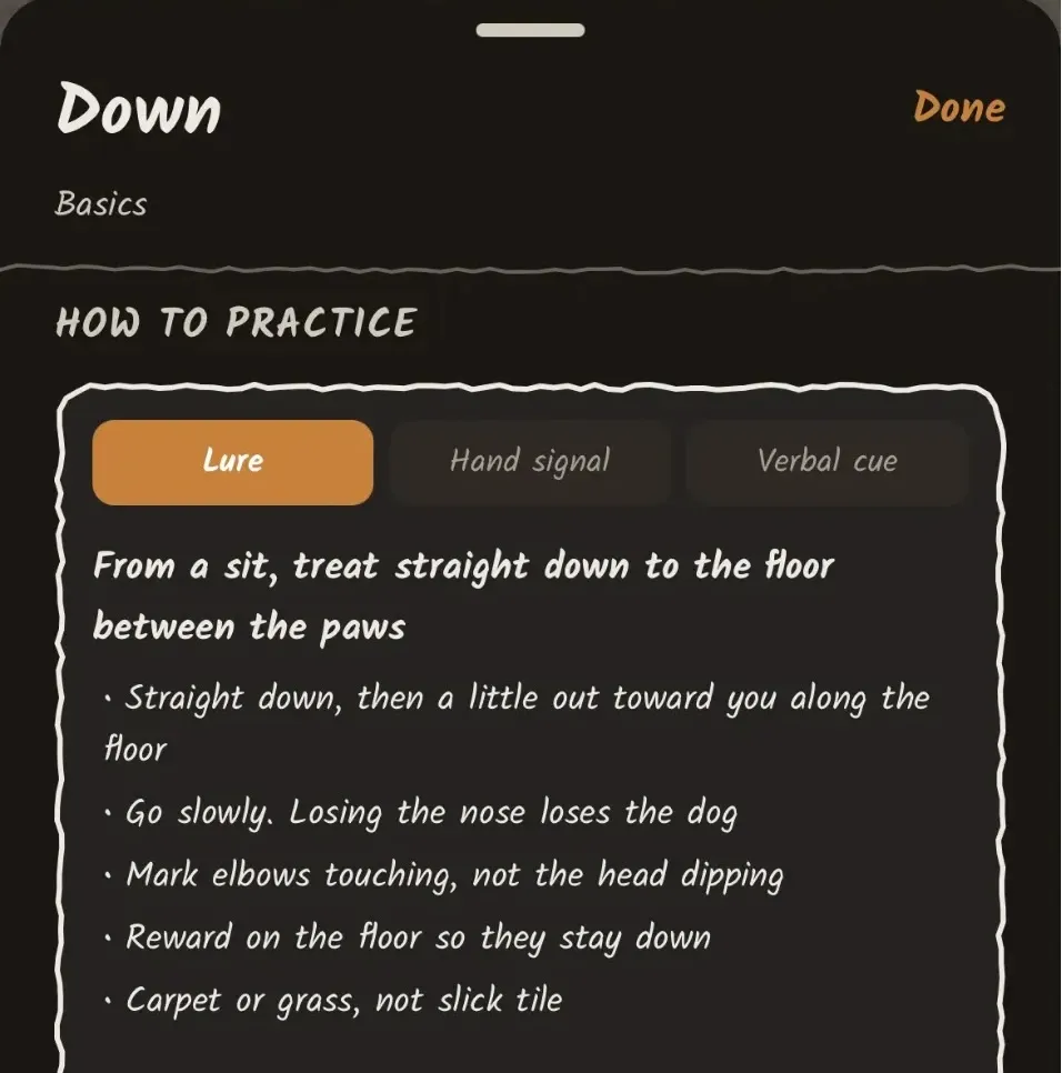 The word detail for Down showing practice instructions: Lure, Hand signal, and Verbal cue tabs, with step-by-step training tips.